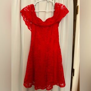 Off the shoulder red dress.